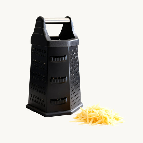 Trendy Shop black 6-sided stainless steel box grater with handle and multiple grating surfaces.